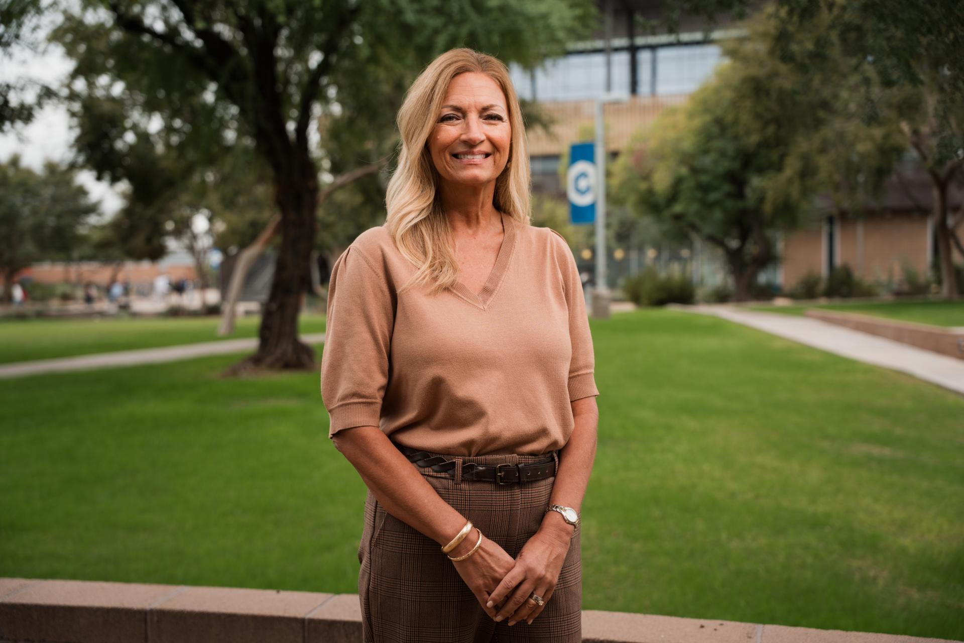 Dr. Amy Diaz standing outside in courtyard