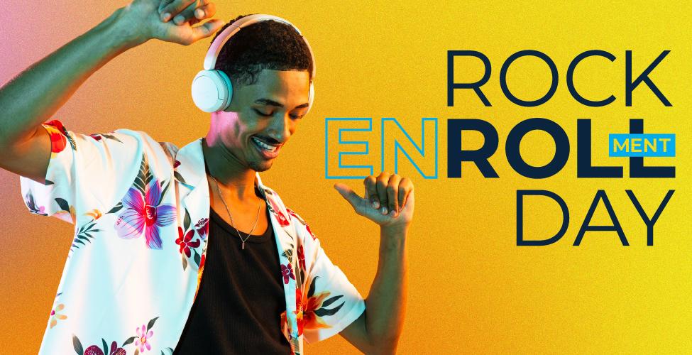 Male wearing floral shirt, and headphones with the words "Rock Enrollment Day"