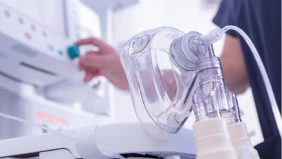 Medical ventilator machine and clear respiratory face mask in a clinical care setting