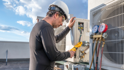 HVAC Technician inspecting an air conditioning unit