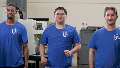 Three males students in blue shirts