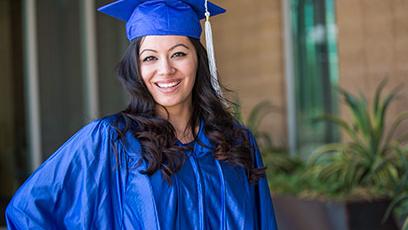 GateWay student Crissy Ramos poses in her blue cap and gown