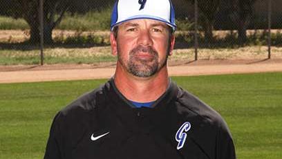 Baseball coach Rob Shabansky poses on a field
