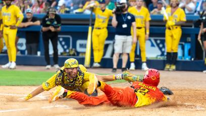 Isaac Parra slides into the base playing Banana Ball