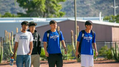 Four GateWay male students walk across campus during the Fall Spirit Week events. 
