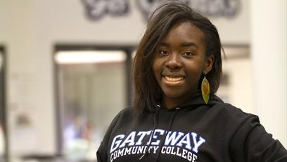 A GateWay Student posing during a past BSU student forum in a black GateWay shirt