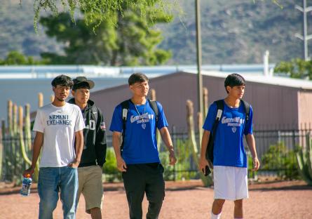 Four GateWay male students walk across campus during the Fall Spirit Week events. 