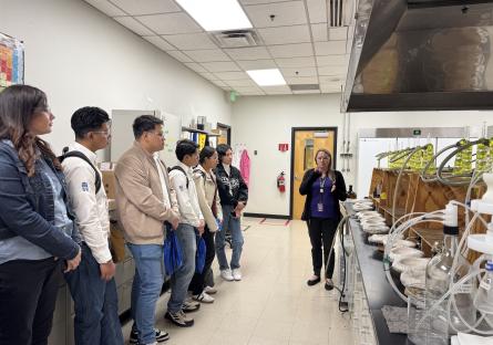 Students from the Universidad de Guanajuato listed to an instructor during their tour of the water utilities labs. 