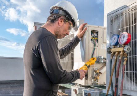 HVAC Technician inspecting an air conditioning unit