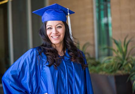 GateWay student Crissy Ramos poses in her blue cap and gown