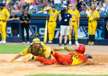 Isaac Parra slides into the base playing Banana Ball