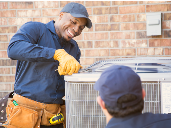 Man working on HVAC unit