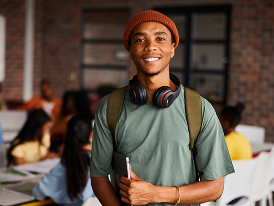 Male student wearing beanie and headphones