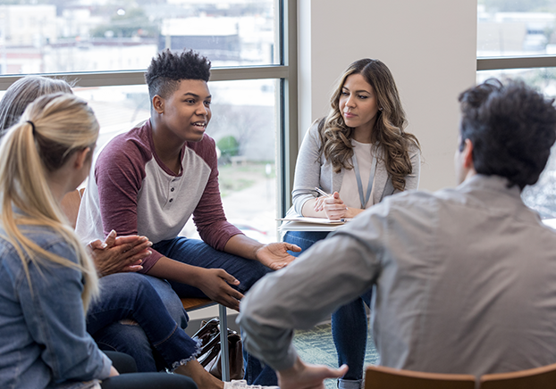 Group of students sitting on chairs