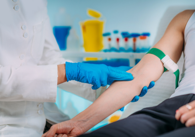 An arm being prepared to get blood drawn.