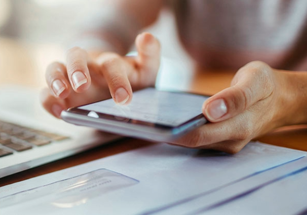 An individual on their phone looking for information
