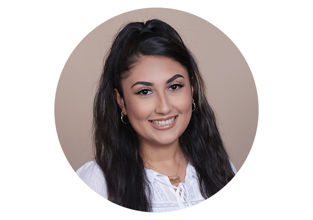 Woman with long dark hair smiling