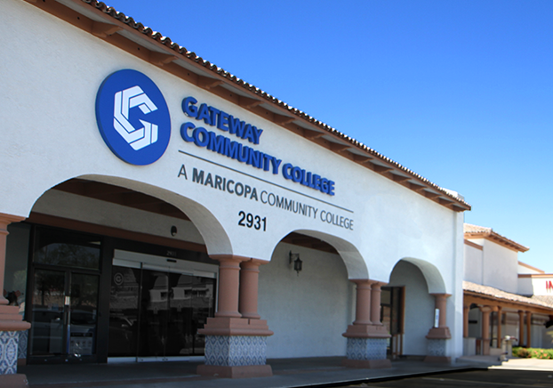 Exterior Deer Valley campus. Building with white stucco with blue horizontal GateWay Community College logo.