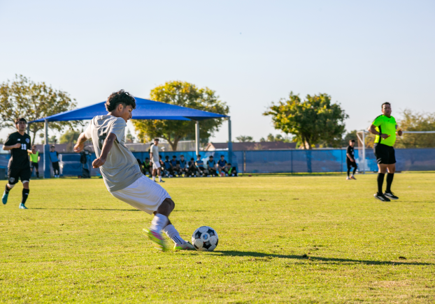 GateWay Soccer Athlete kicking the ball toward the goalie