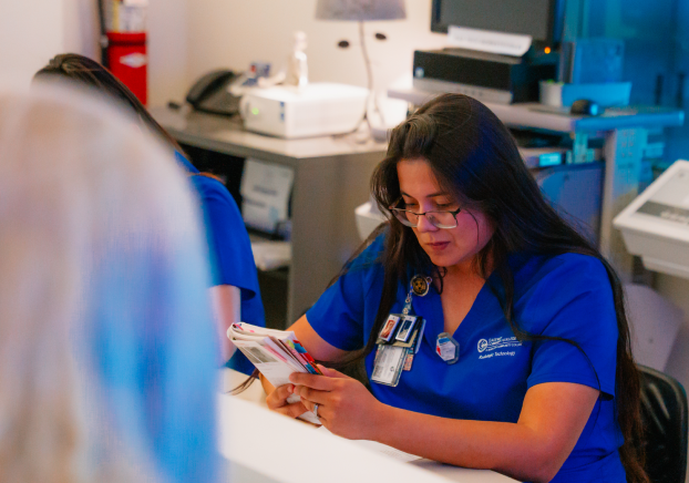 Healthcare student wearing blue scrubs