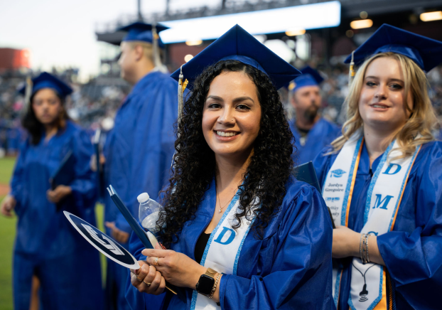 Graduate in cap and gown