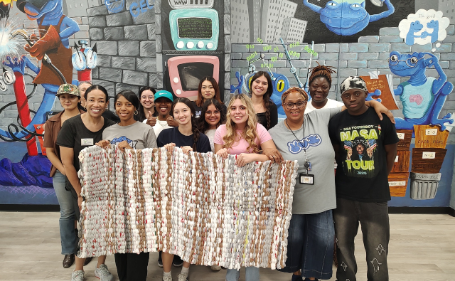 Students gathered for picture about DSquared Mats for Hope