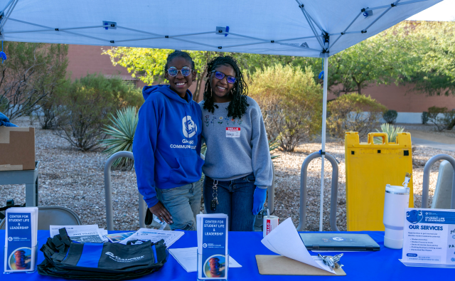 2 students gathered outside on campus for student life